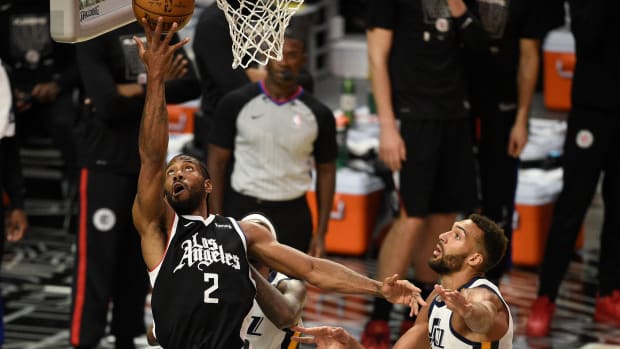 Jun 12, 2021; Los Angeles, California, USA; LA Clippers forward Kawhi Leonard (2) goes up for a shot in front of Utah Jazz center Rudy Gobert (27) in the third quarter during game three in the second round of the 2021 NBA Playoffs. at Staples Center. Mandatory Credit: Kelvin Kuo-USA TODAY Sports